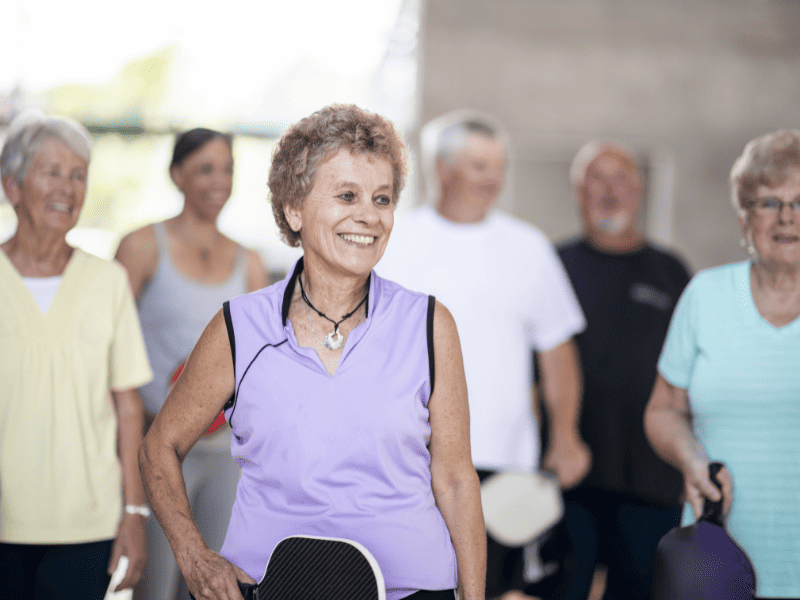 older folks playing pickleball