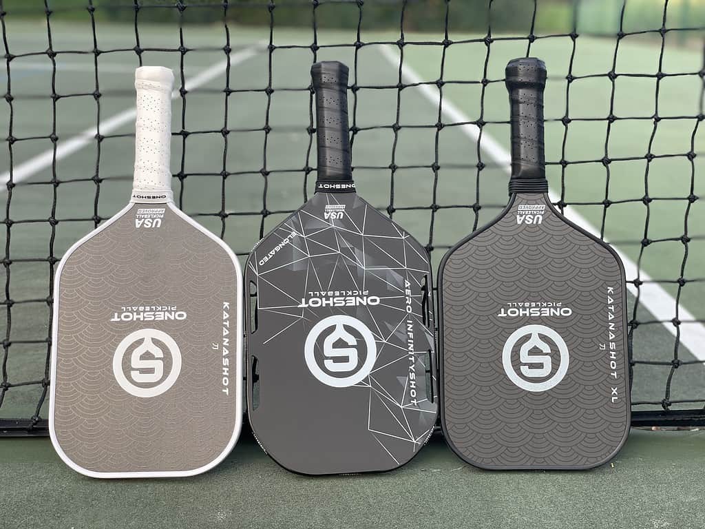 three oneshot pickleball paddles